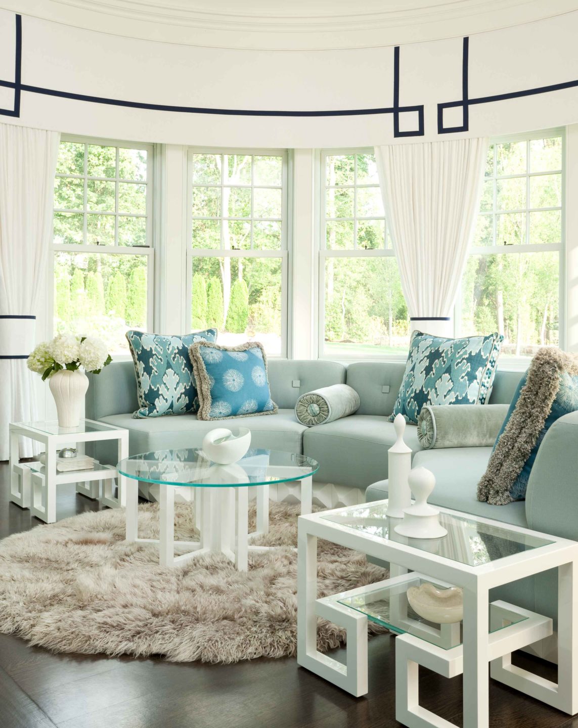 Nicole-Fuller-Interiors-Dutchess-Suffern-Estate-living-room-blue-sofa-graphic-valence-geometric-coffee-tables-new-york-interior-designer